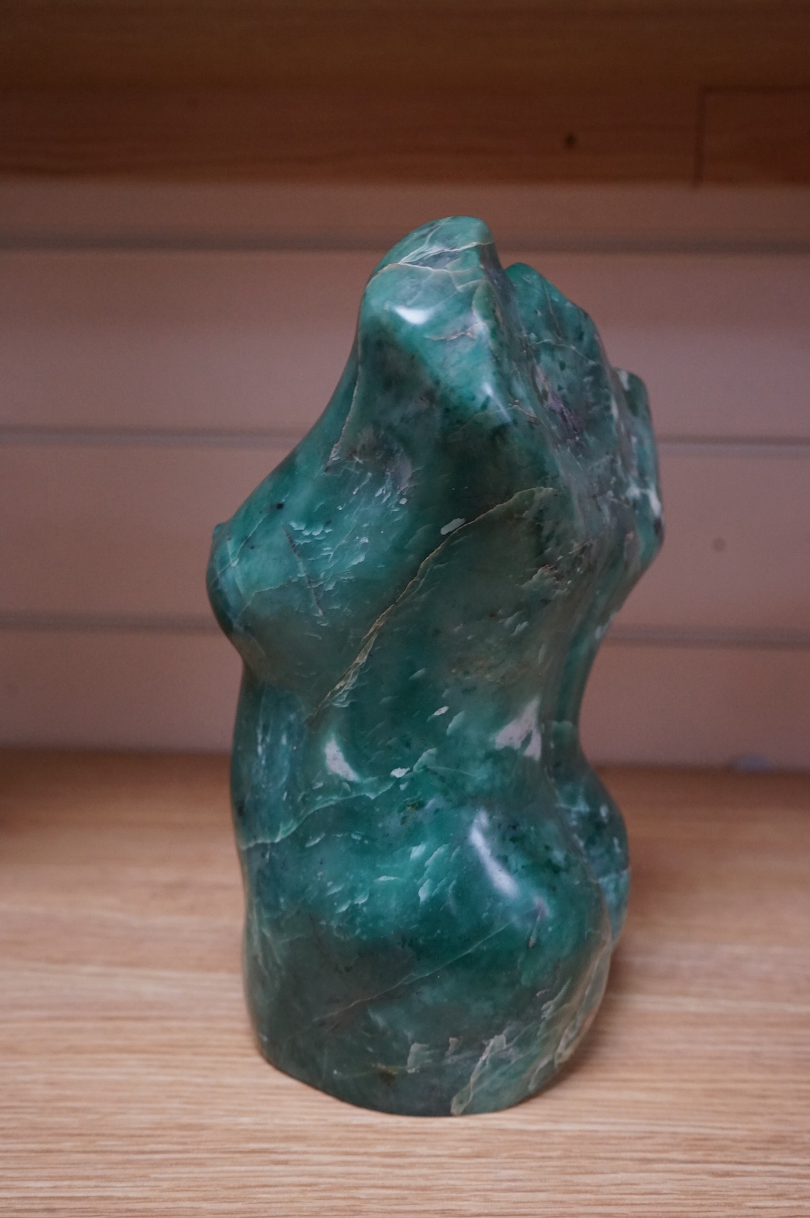 A Shona carved verdite torso of a woman. Condition - fair, restored area to shoulder